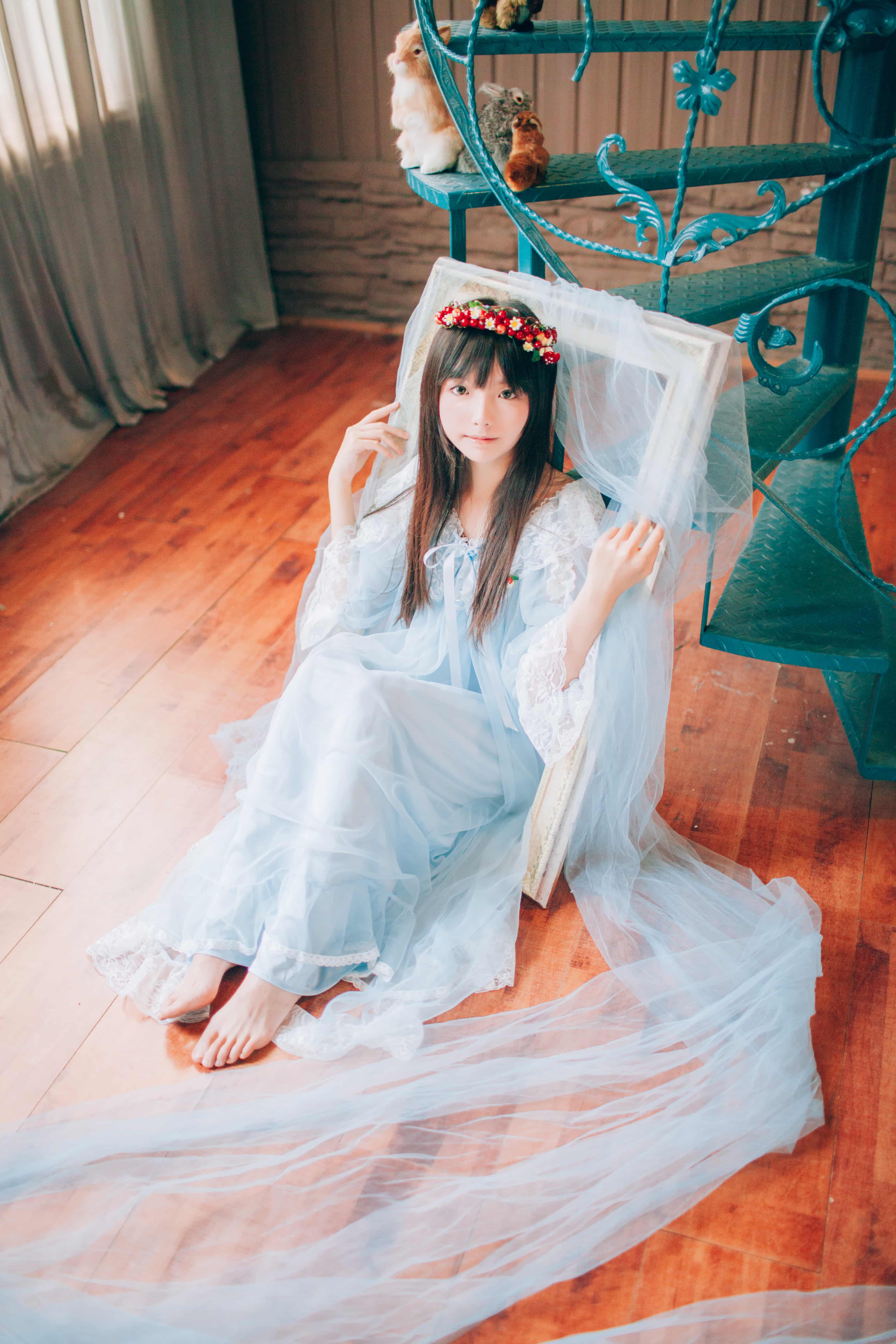 Soft-focus image of feet draped in translucent silk stockings, toes gently pressing against the veil for a coy reveal.